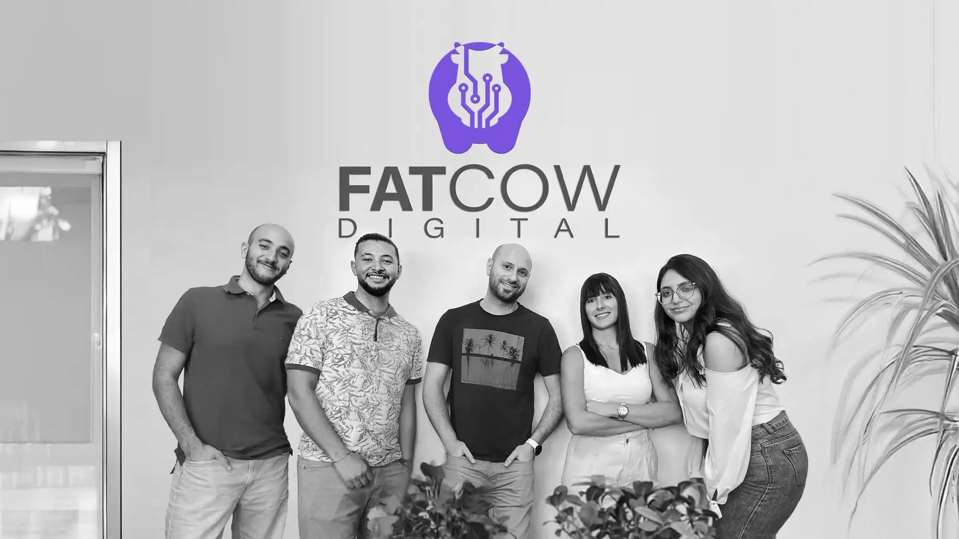 Original Team of Fatcow Digital marketing agency in lebanon with company logo on wall behind them